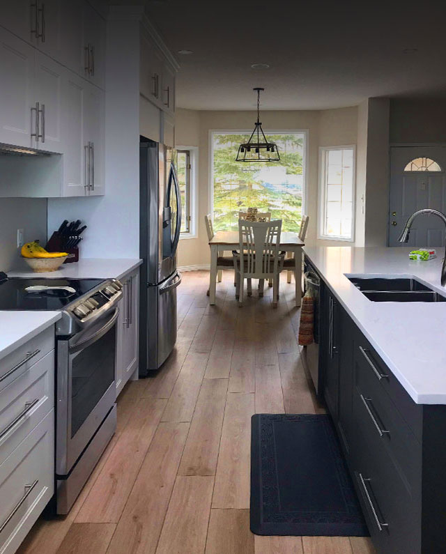 Farrow Custom Construction & Renovations - Kitchen Renovations with Subway Tile and white cabinets, stainless steel appliances and white countertop
